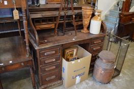 An oak roll top desk.