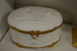 A Continental ormolu mounted porcelain box and cover.