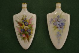 Two Royal Worcester blush ivory and floral decorated scent bottles.