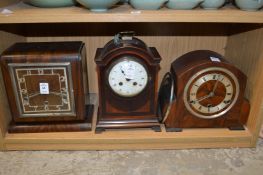 Three mantle clocks.