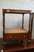 A mahogany two tier stand with small drawer.