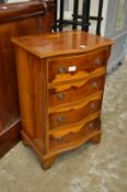 A small yew wood chest of drawers.
