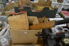 An old cricket bat and various toys.