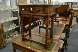 A small oak single drawer side table.