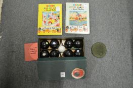 A boxed set of carpet bowls and two Noddy books.