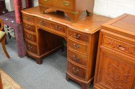 A yew wood twin pedestal desk.
