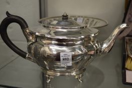 A silver teapot and a plated tazza.