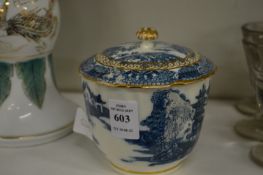 A blue and white sugar bowl and cover.