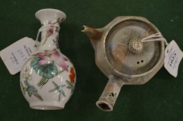 A small Chinese teapot and a little baluster shaped vase.