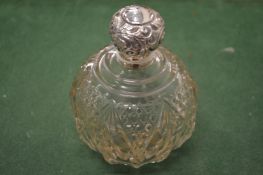 A good cut glass scent bottle with silver mount.