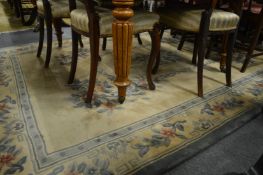 A cream ground Chinese carpet 285cm x 185cm.