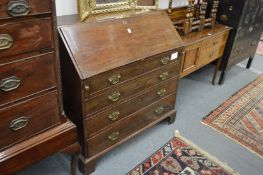 A George III oak bureau.