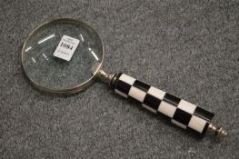 A decorative magnifying glass.