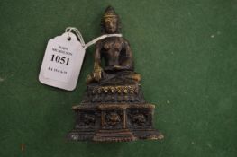 A small Eastern bronze buddha.
