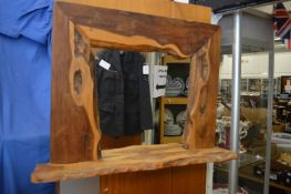 A rustic yew wood mirror.