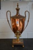 A classical copper urn shaped samovar.