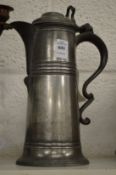 A pewter flagon.