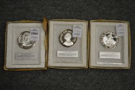 A set of three decorative medallions.