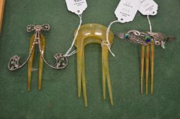 Two highly decorative horn hair ornaments/clips together with a pair of horn hair clips.