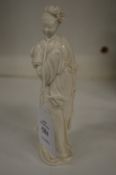 A small Chinese blanc de chine porcelain figure.