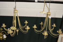 A pair of painted five branch chandeliers.