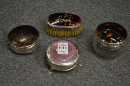 A silver and enamel decorated circular jewellery box on three feet and three similar items.