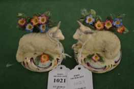 A small pair of Staffordshire models of recumbent sheep (af).