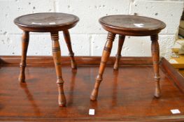 A pair of circular stools.