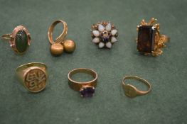 A Chinese yellow metal signet ring stamped 14k and a collection of other rings.