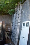 Various aluminium extending ladders.