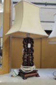 A Chinese hardwood table lamp.