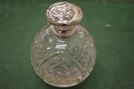 A good cut glass scent bottle with silver mount.