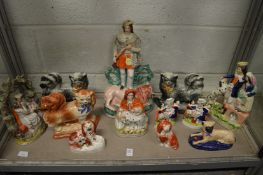 A good collection of Staffordshire figures to include dogs etc.