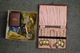 A box of costume jewellery and a cased set of coffee spoons.