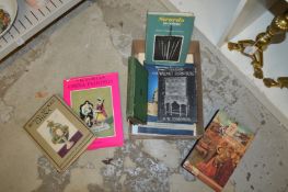 A box of art reference books.