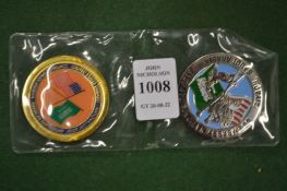 Two commemorative medallions.