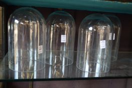 Five glass domes 10in high x 6in diameter.