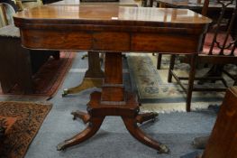 A 19th century mahogany D shaped fold over card table on column support with splay legs.