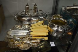 Various plated wares to include an entree dish, cutlery etc.
