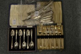 A cased set of plated coffee spoons and other items.