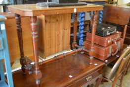 A Victorian walnut stretcher table.