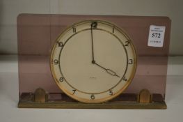 A stylish desk or mantle clock.