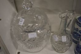 A large cut glass punch bowl and cover together with a claret jug.