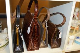 Four ladies leather handbags.