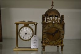 A small Swiza bedside clock and a miniature lantern clock.
