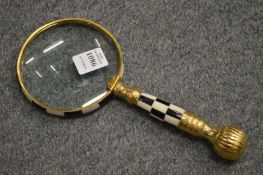 A decorative magnifying glass.