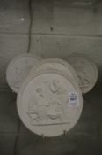 A set of four Royal Copenhagen Parian porcelain circular plaques.