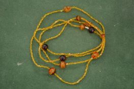 An amber style necklace.