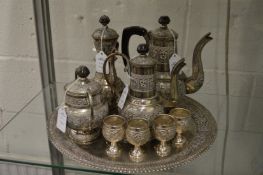 An Eastern white metal four piece coffee service with matching tray and four goblets.