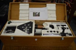 A boxed astronomical telescope.